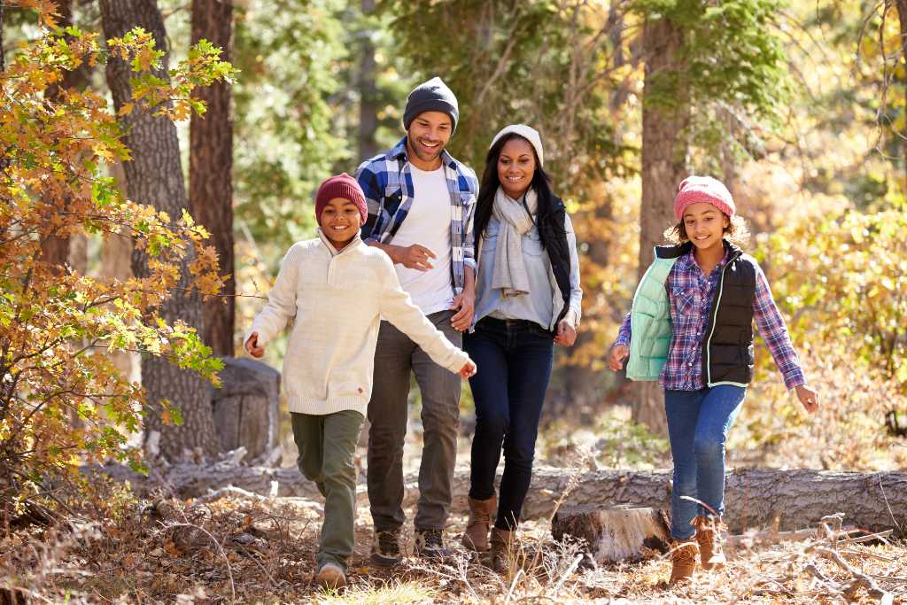family hiking in the woods
