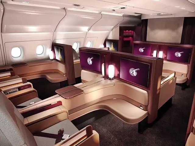 Qatar Airways plane flying.